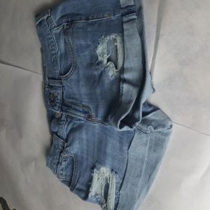 Jean shorts distressed.